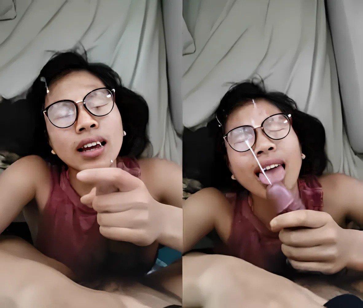 The bespectacled girl stroked his cock and shot it all over her face