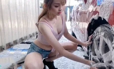Sexy female car wash employee