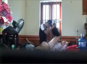 Female student lies down watching phone while her lover explores - Viet69